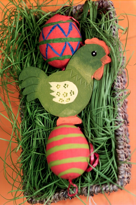 Colorfully Painted Easter Eggs with Chick in Basket