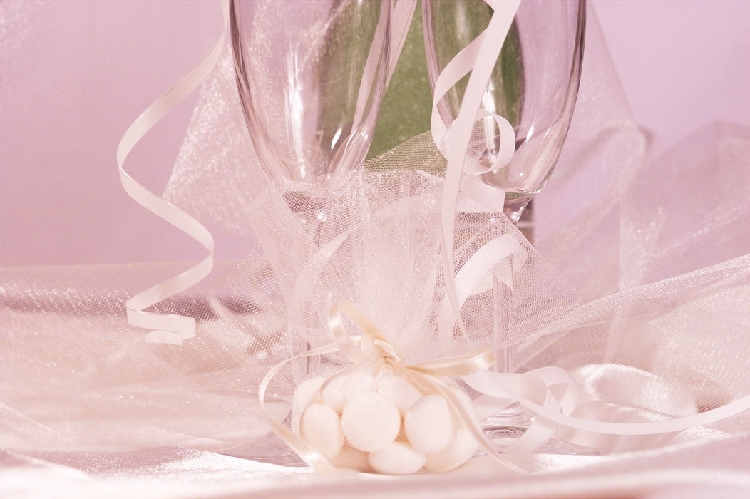 The Wedding Day:  Champagne Glasses with Candies and Ribbons