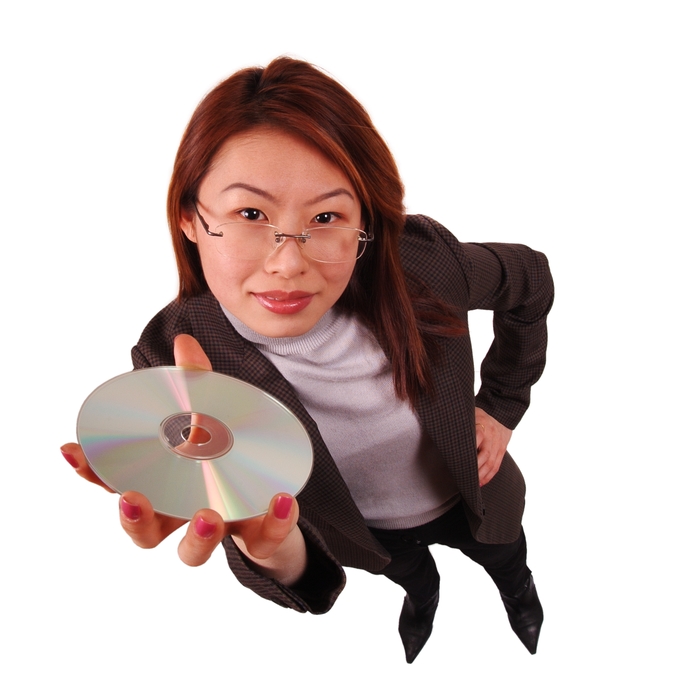 Businesswoman Holding CD-ROM