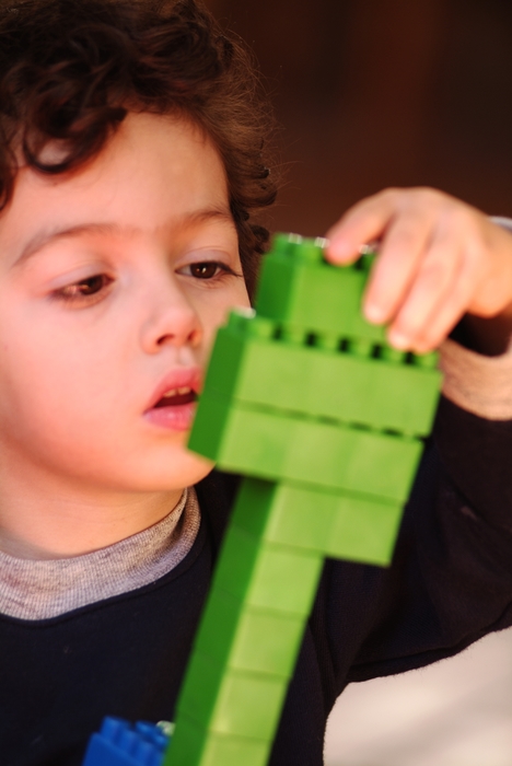 Young Boy with Building Blocks