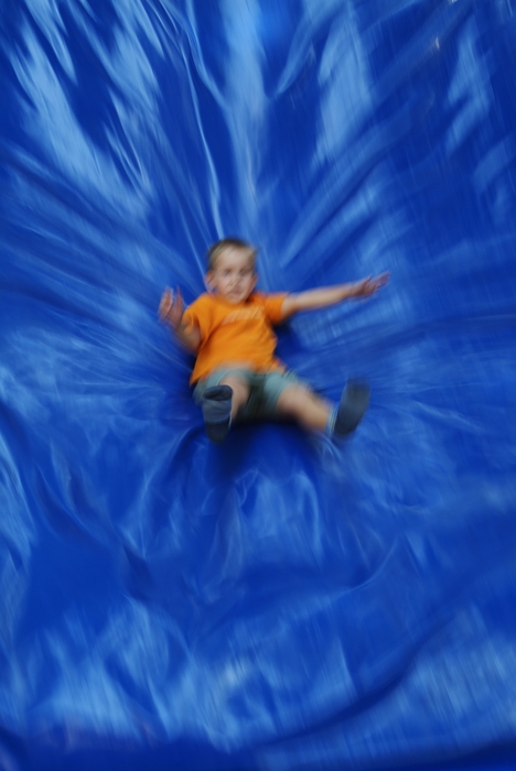 Boy Coming Down a Slide