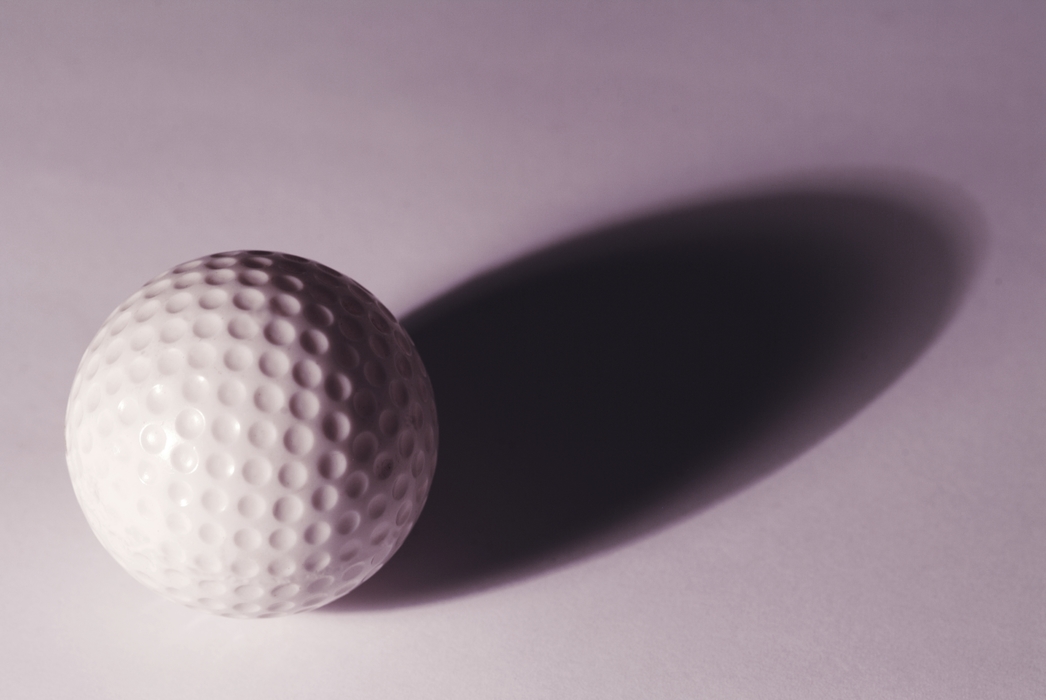 Golf Ball with Dramatic Shadow