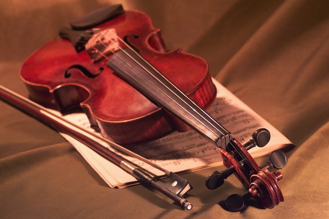 Violin with Bow and Sheet Music