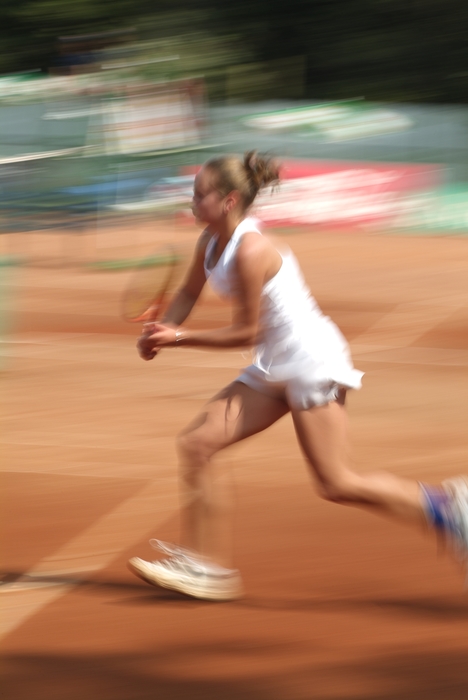 Tennis Player Racing to the Net for Forehand Shot