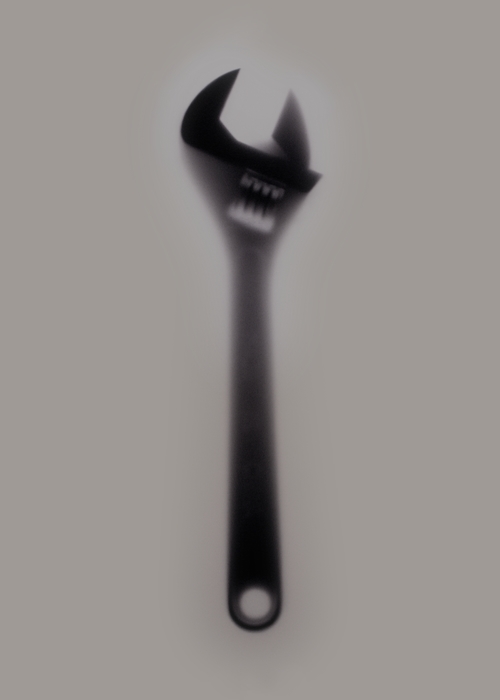 Blurred Silhouette Adjustable Wrench