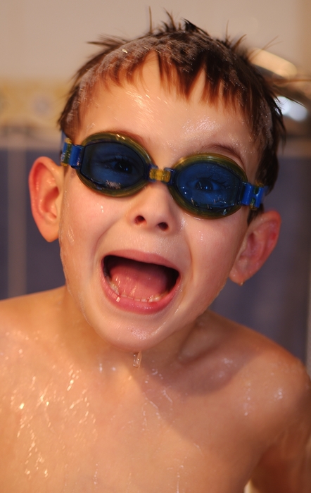 Young Boy with Goggles in The Bathtub
