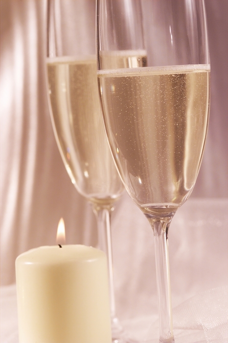 The Wedding Day:  Champagne Glasses with Candle Flame