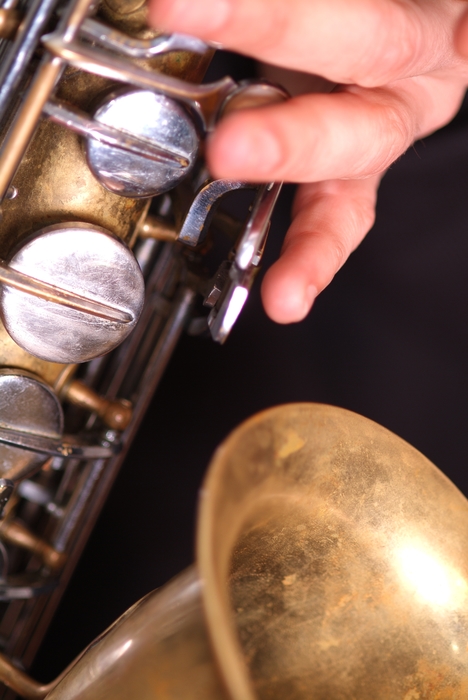 Saxophonist in Orchestra Close-Up Fingers on Keys