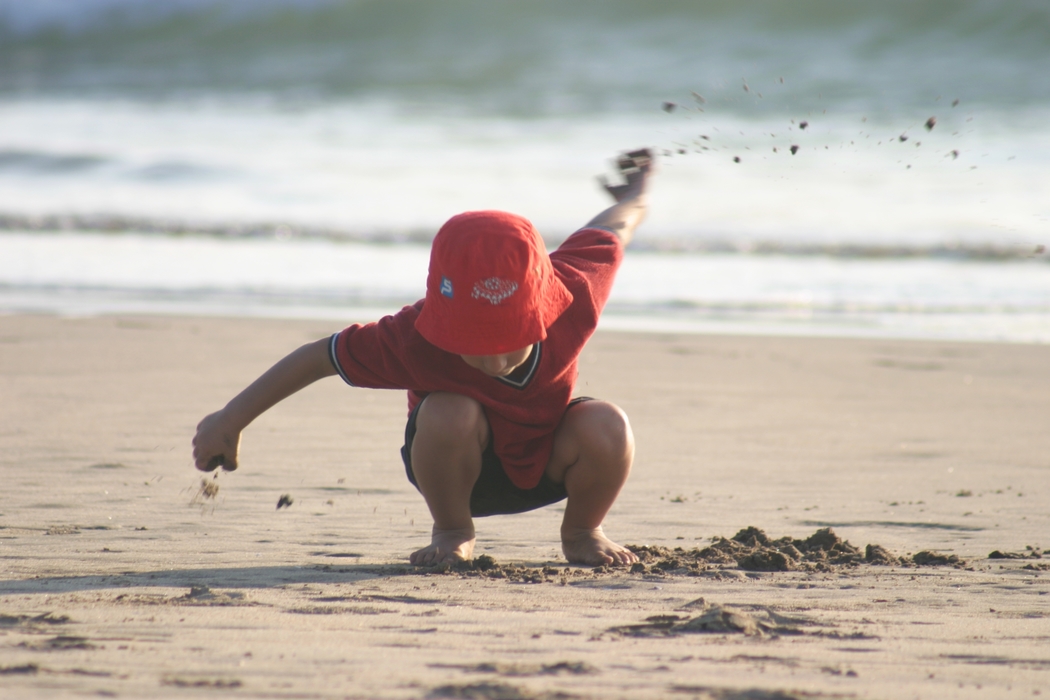 Child Playing in The Sand