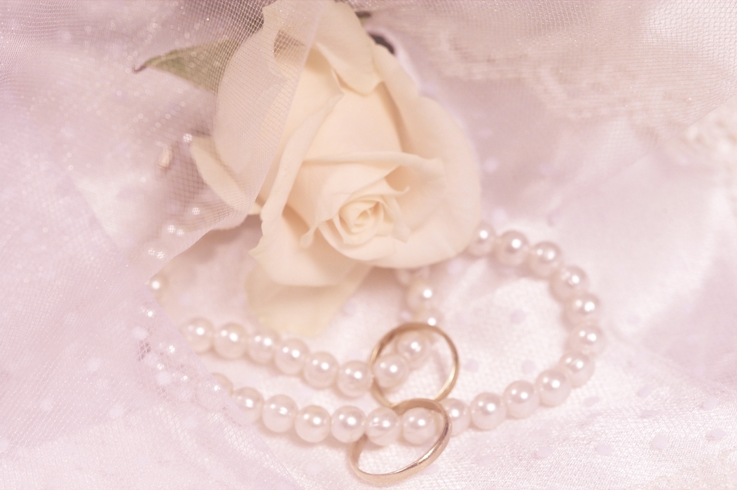 The Wedding Day:  Wedding Rings with Pearls and White Roses