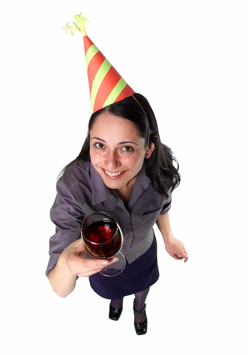 Woman Celebrating with Glass of Red Wine
