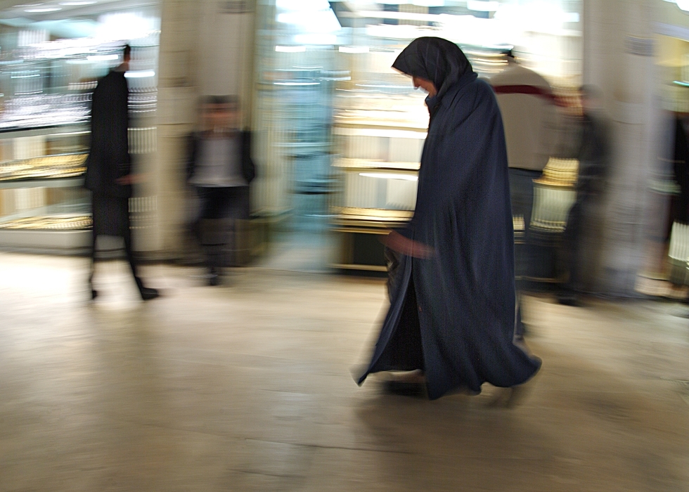 Muslim Woman Walks on the Street