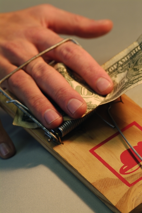 Hand Caught in Mousetrap Trying to Steal Money