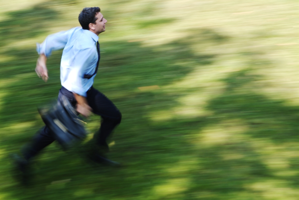 Businessman Running with Briefcase