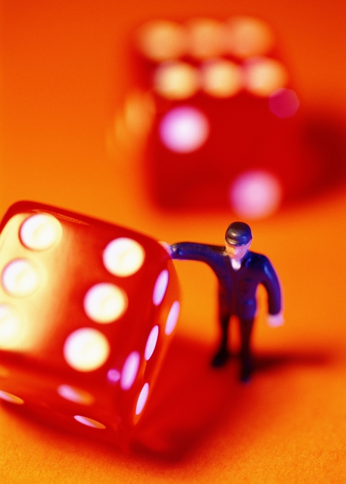 Toy Person Rolling a Dice