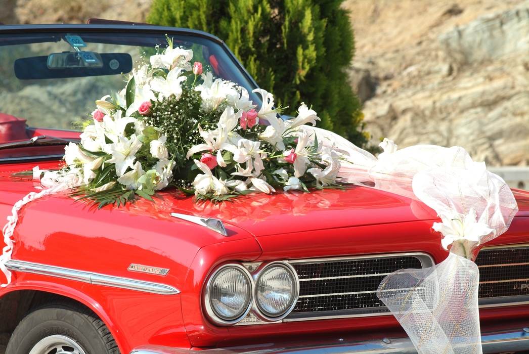 The Wedding Day:  The Honeymoon Car with Wedding Bouquet