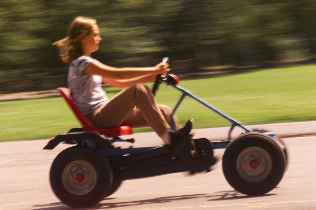 Girl Riding a Pedal Driven Go-Cart