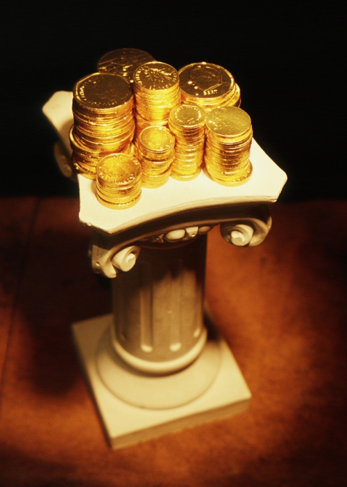 Pedestal with Stacks of Gold Coins on Top of It