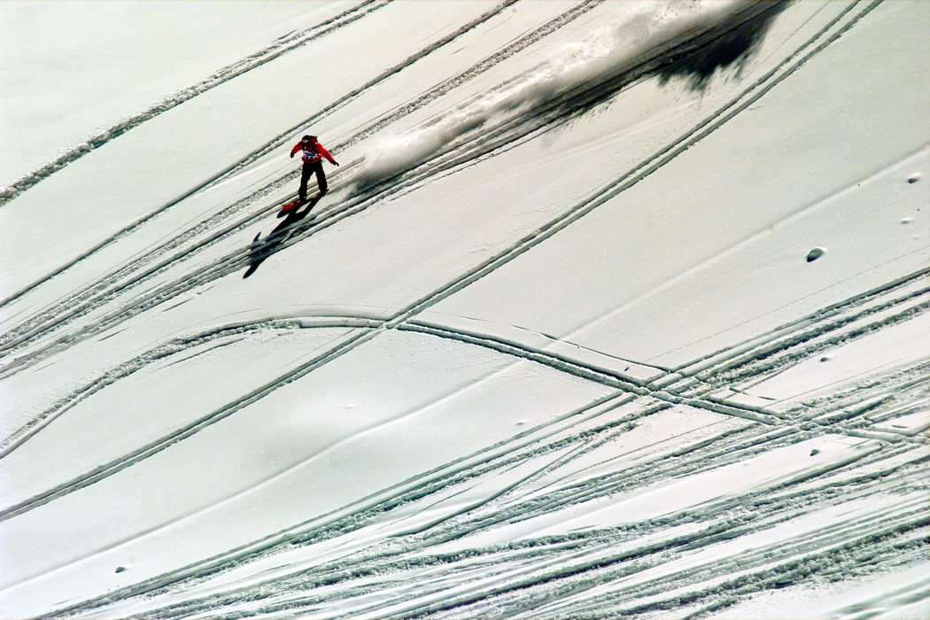 Downhill snowboarder Making Trails