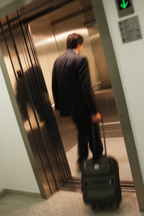 Man Taking His Luggage to His Room