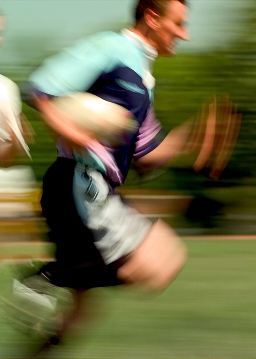 Rugby Player Runs with the Ball